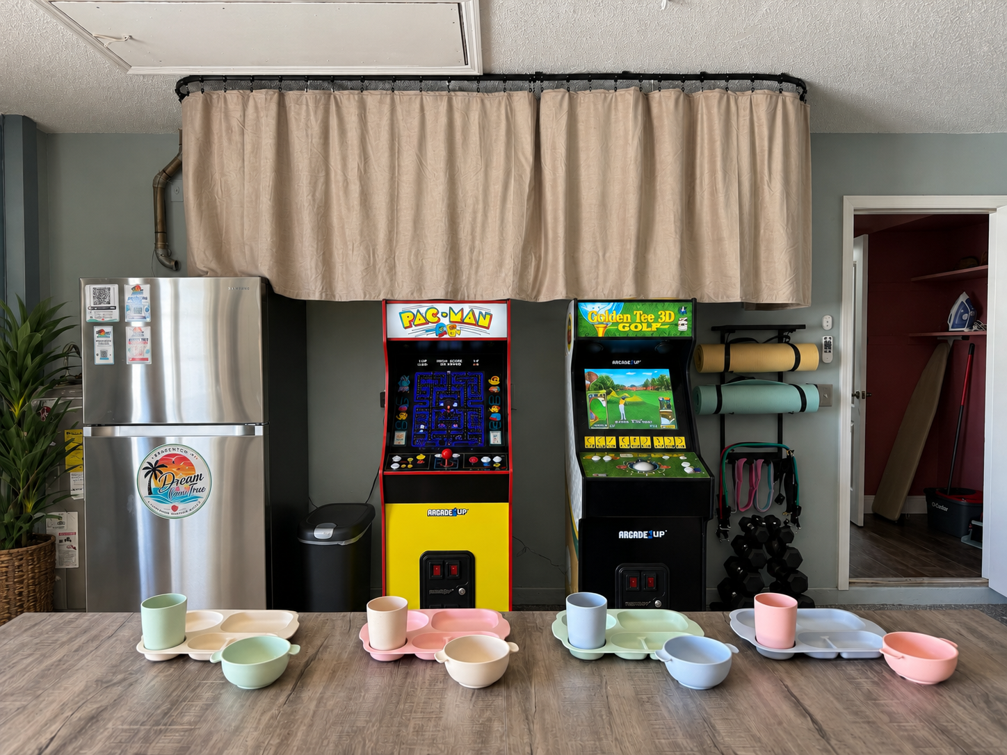 Pastel dinnerware in arcade game room at Dream Come True in Bradenton, Florida