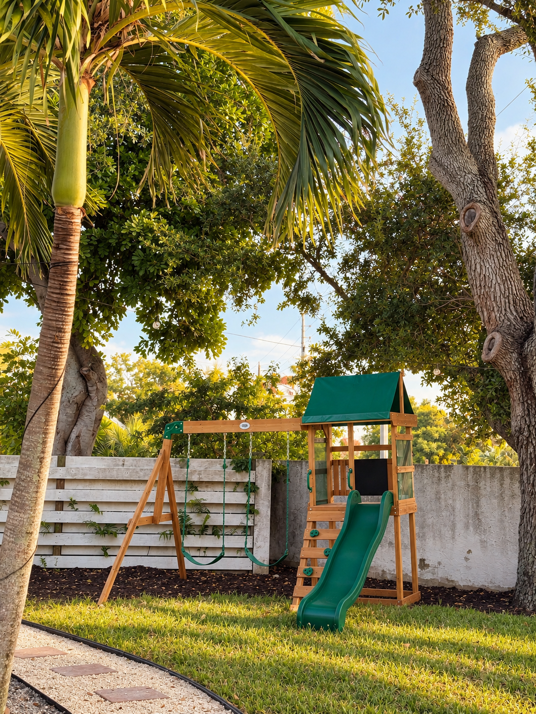 Sunlit backyard playset oasis at Dream Come True in Bradenton, Florida
