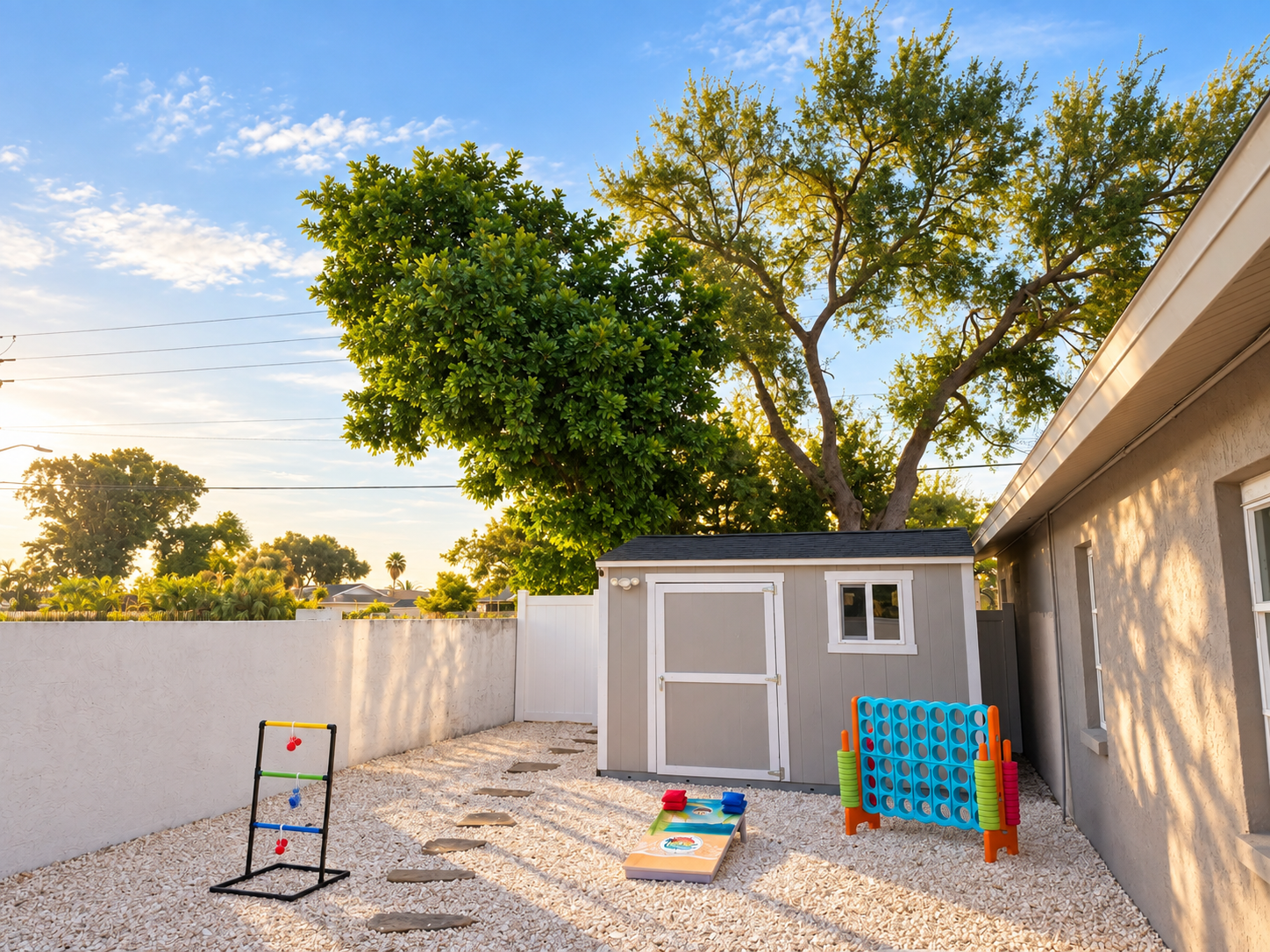 Sunlit backyard games and shed at Dream Come True in Bradenton, Florida