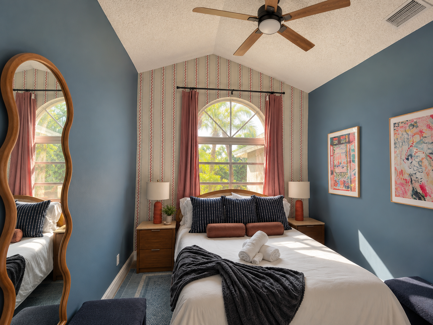Sunlit bedroom with arched window at Dream Come True in Bradenton, Florida